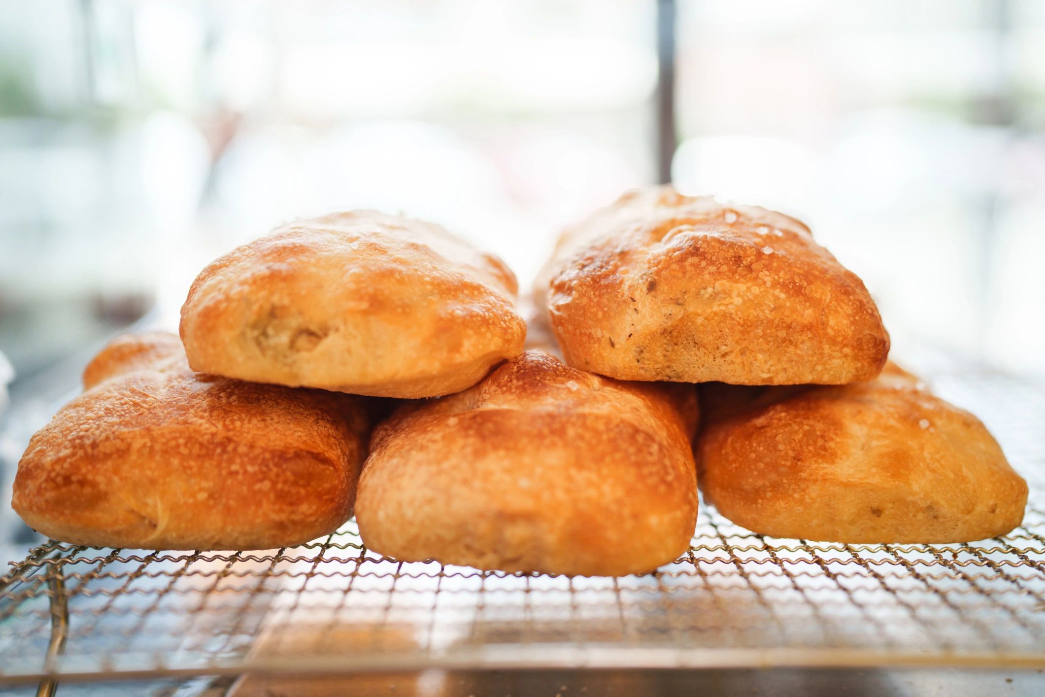 Freshly baked breads and buns arranged in a bakery