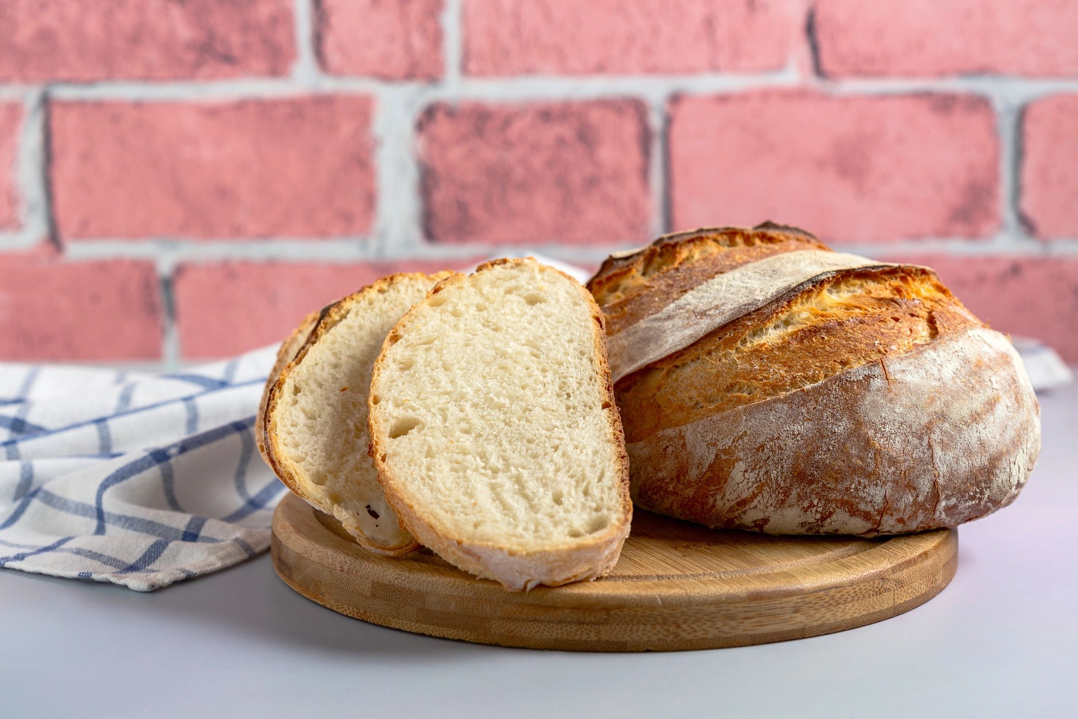 Sliced sourdough loaf on a wooden board