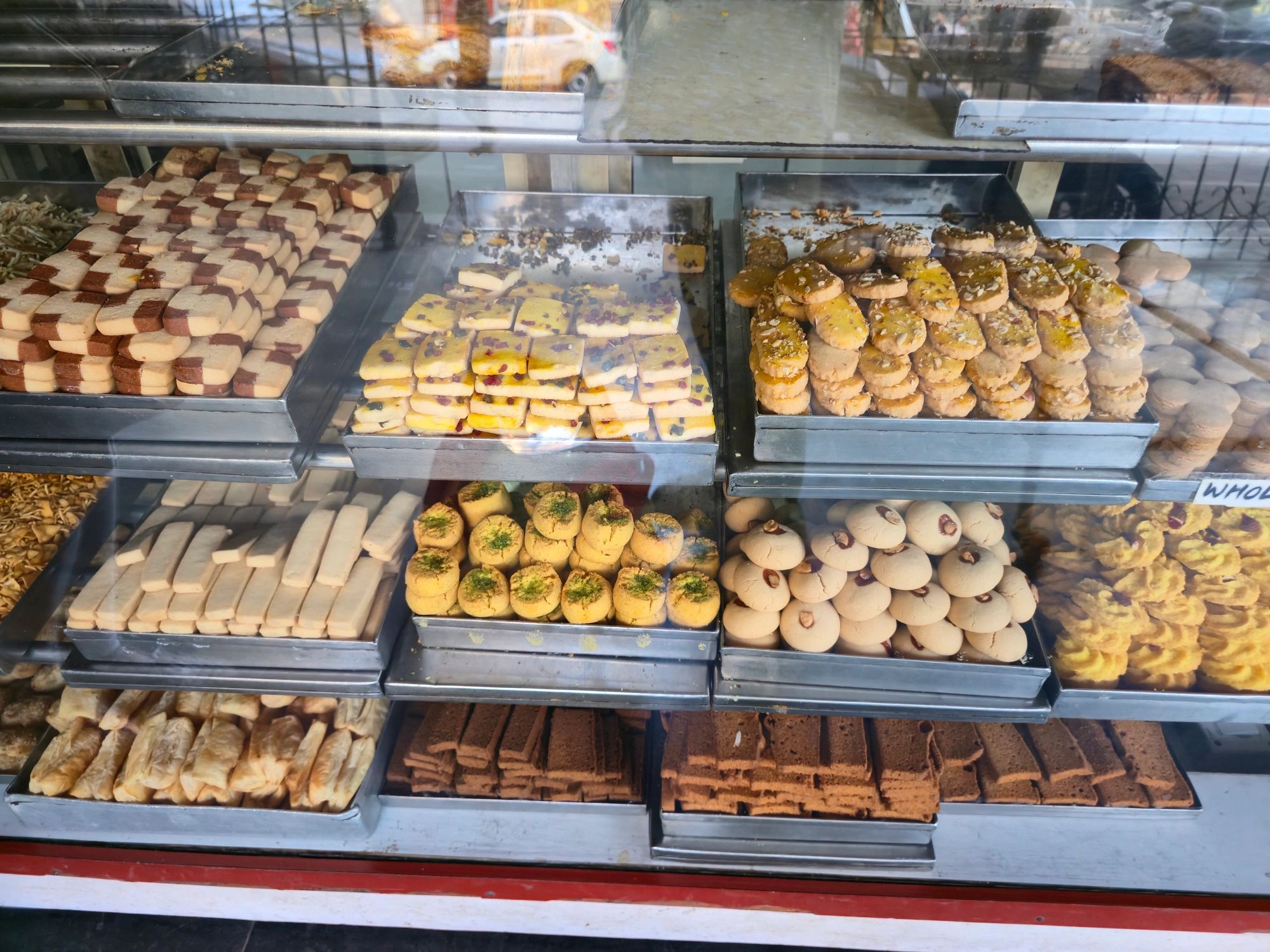 Assorted cookies and biscuits in a bakery display case